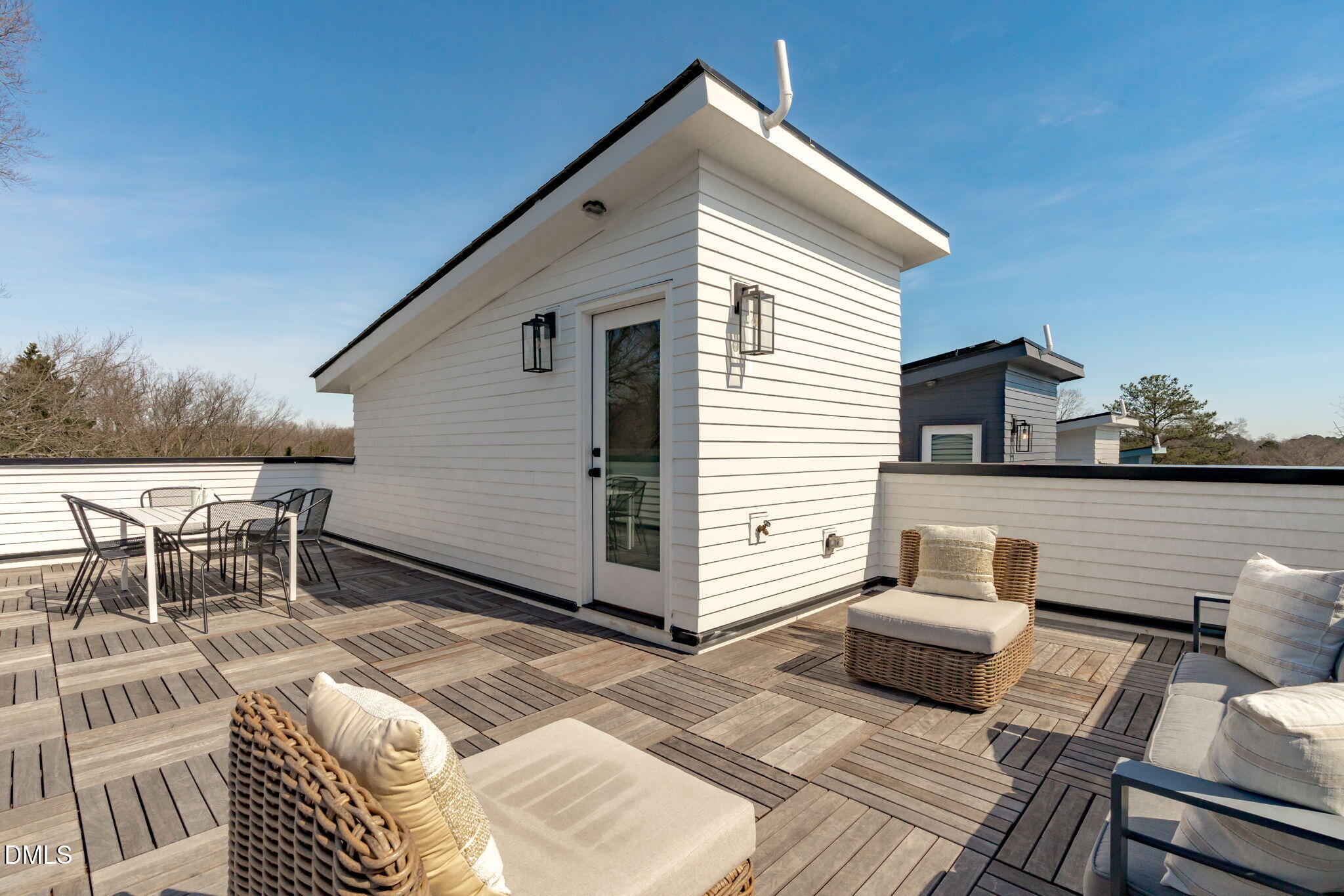 610 Rocky Knob Court Raleigh, NC 27601 - Photo 3 of 48 a view of a chairs and table in the back yard of the house