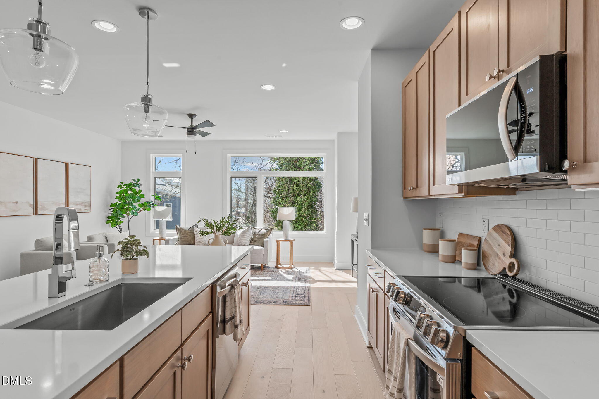 610 Rocky Knob Court Raleigh, NC 27601 - Photo 6 of 48 a kitchen with stainless steel appliances granite countertop a sink stove and cabinets