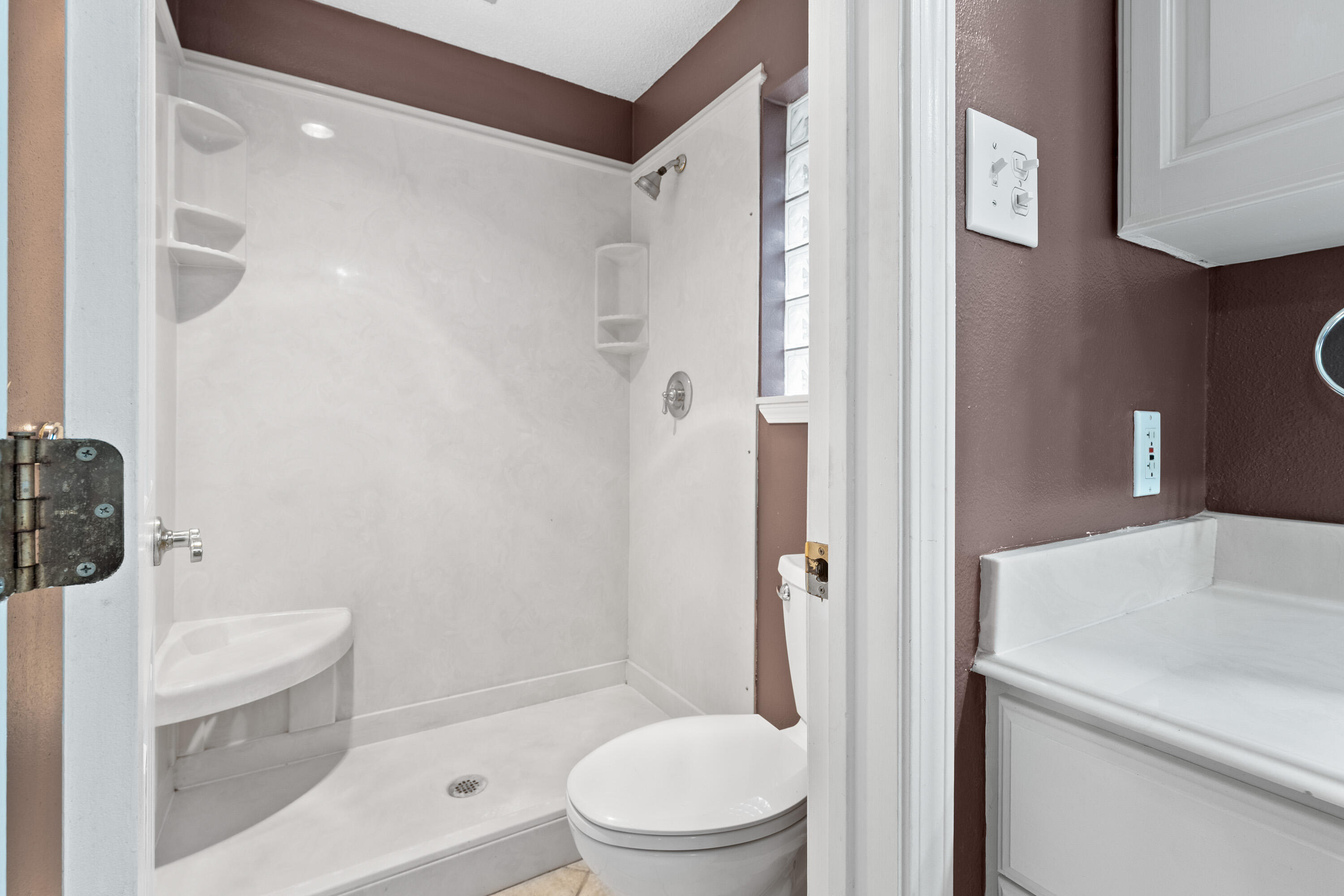 4403 78th Street Lubbock, TX 79424 - Photo 17 of 29 a white toilet sitting next to a bathroom sink