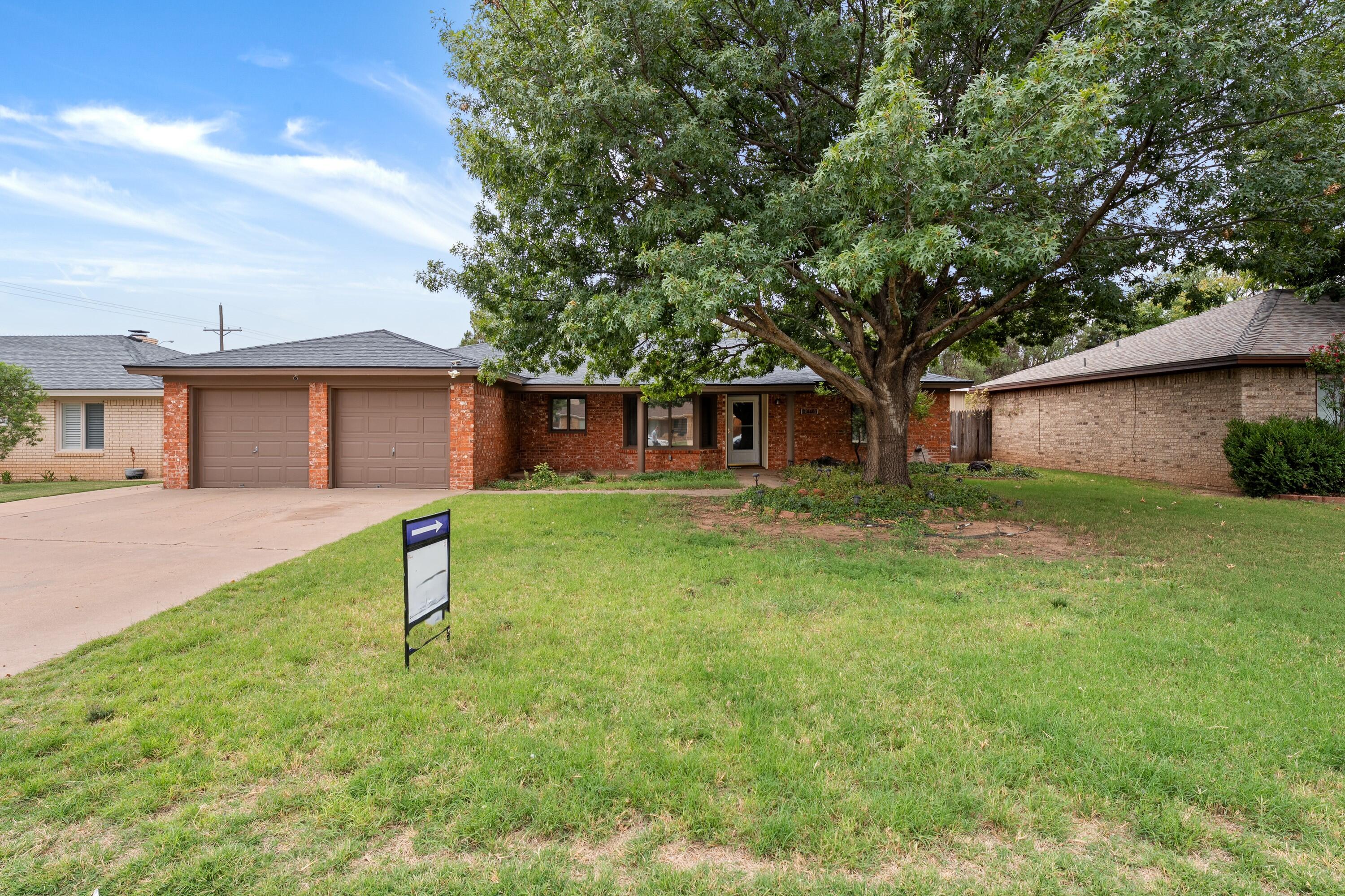 4403 78th Street Lubbock, TX 79424 - Photo 3 of 29 a house view with a garden space