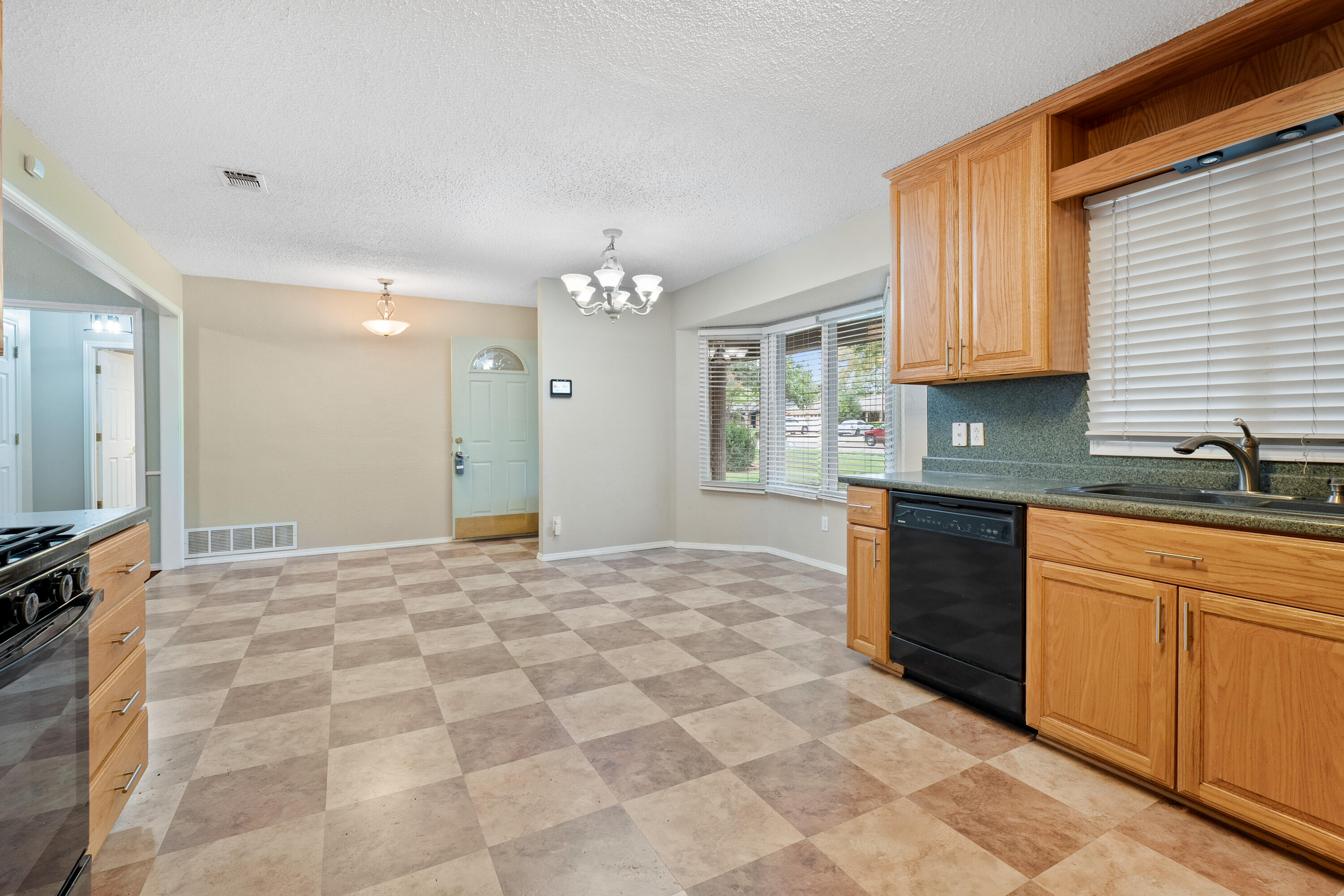 4403 78th Street Lubbock, TX 79424 - Photo 8 of 29 a kitchen with stainless steel appliances granite countertop a sink and cabinets