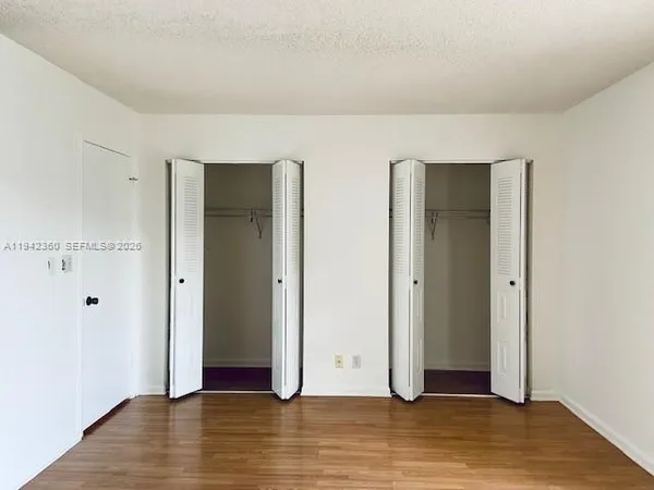 a view of a livingroom with wooden floor
