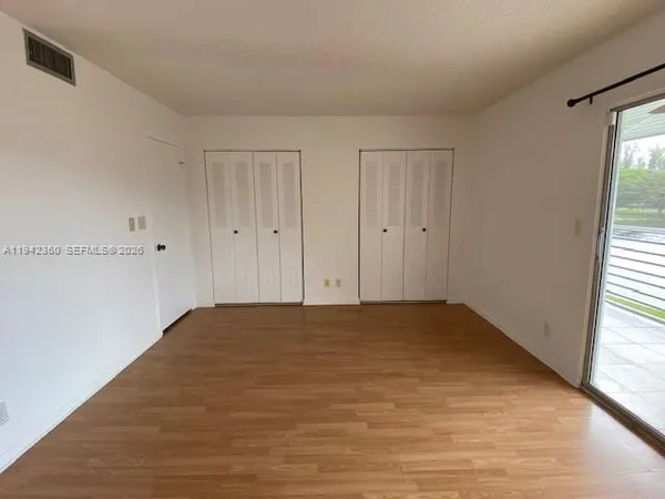 a view of an empty room and window