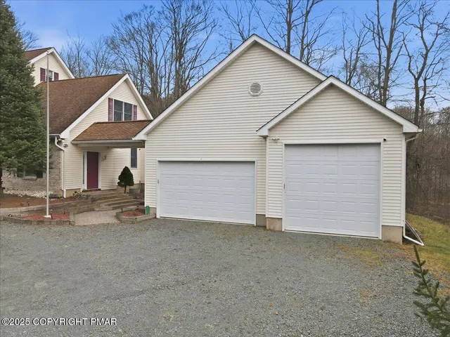 a living room with furniture a window and gym equipment