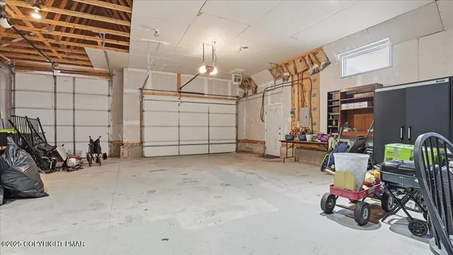 a view of a bedroom with wooden floor