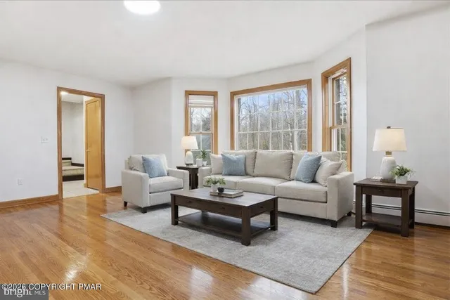 a bathroom with a sink a toilet and shower curtain