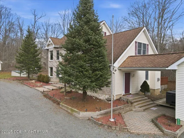 a kitchen with stainless steel appliances granite countertop a sink a stove and cabinets