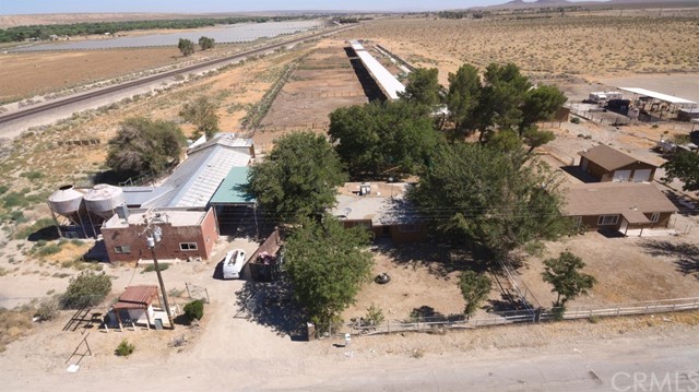 14600 Bryman Road Oro Grande, CA 92368 - Photo 1 of 1 an aerial view of a house with a yard and lake view