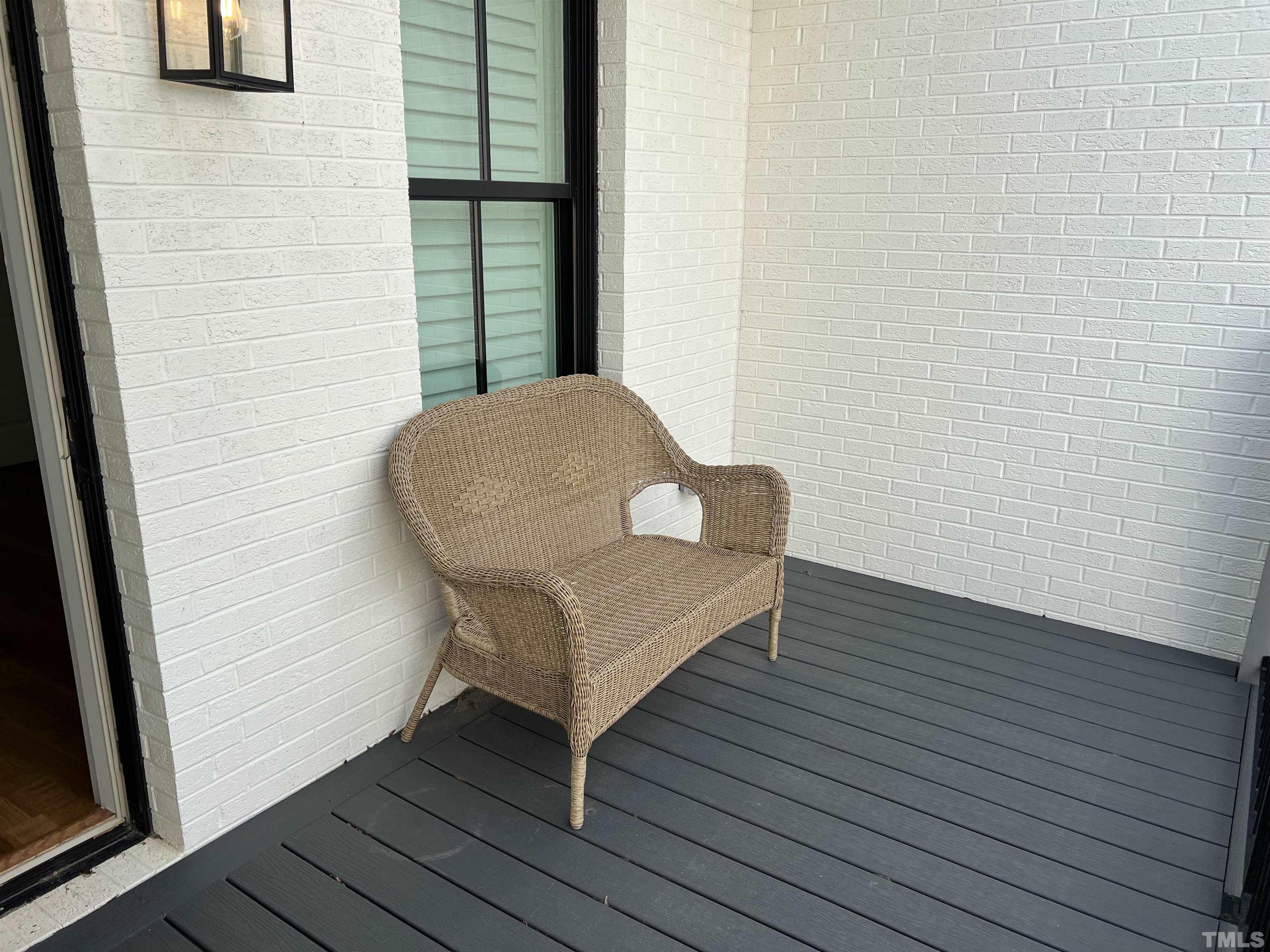 604 Daniels Street, Unit C Raleigh, NC 27605 - Photo 20 of 34 a view of a hallway with wooden floor and a potted plant