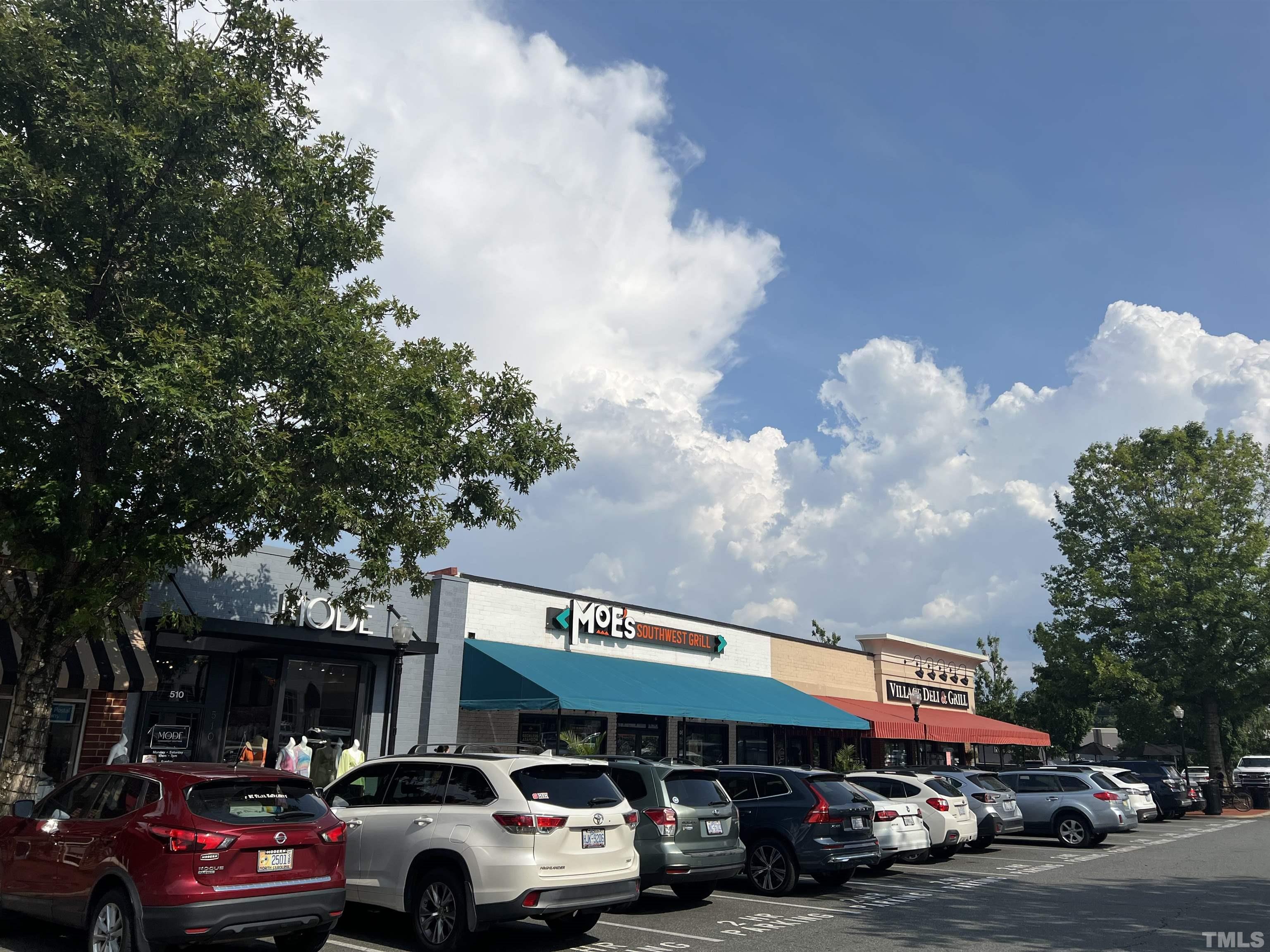604 Daniels Street, Unit C Raleigh, NC 27605 - Photo 2 of 34 a view of a cars parked in front of a building