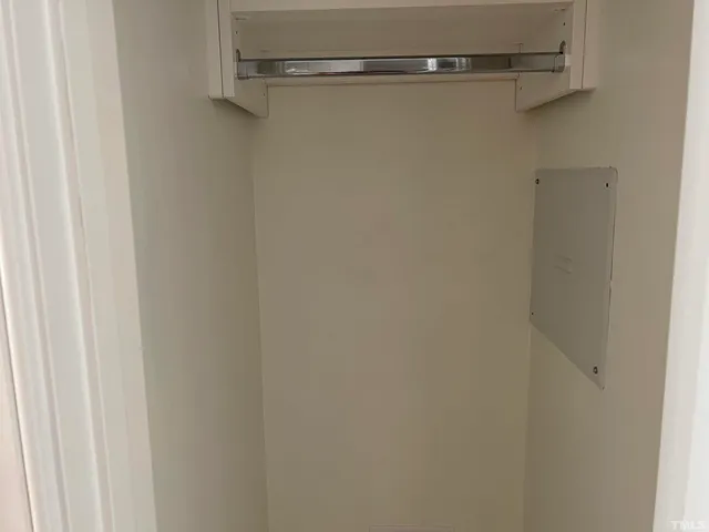 a kitchen with stainless steel appliances white cabinets and a refrigerator