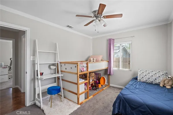 a bed room with a bed and a window