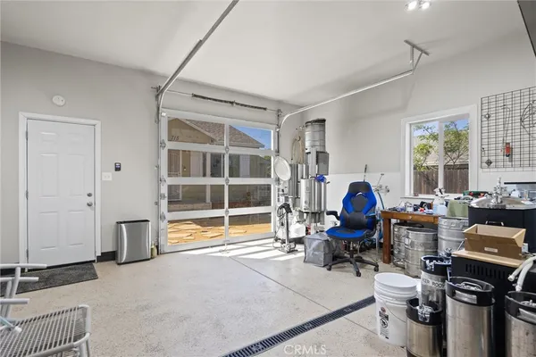 a living room filled with furniture and a window