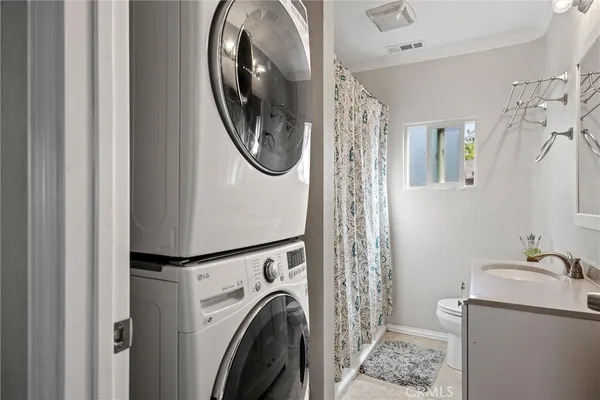 a view of a hallway with washer and dryer