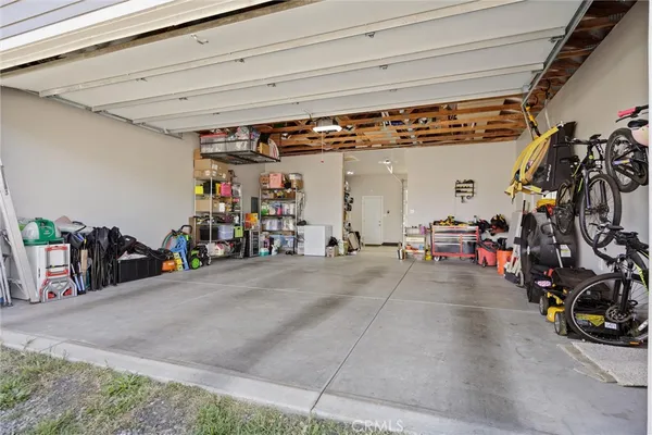 a view of a garage with rack and bicycle