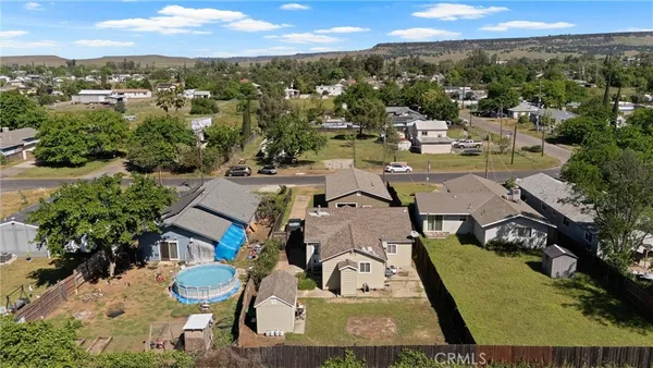 an aerial view of residential houses with outdoor space