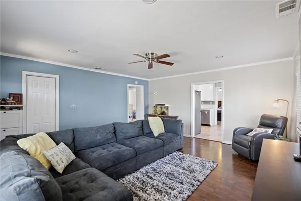 a living room with furniture and a rug