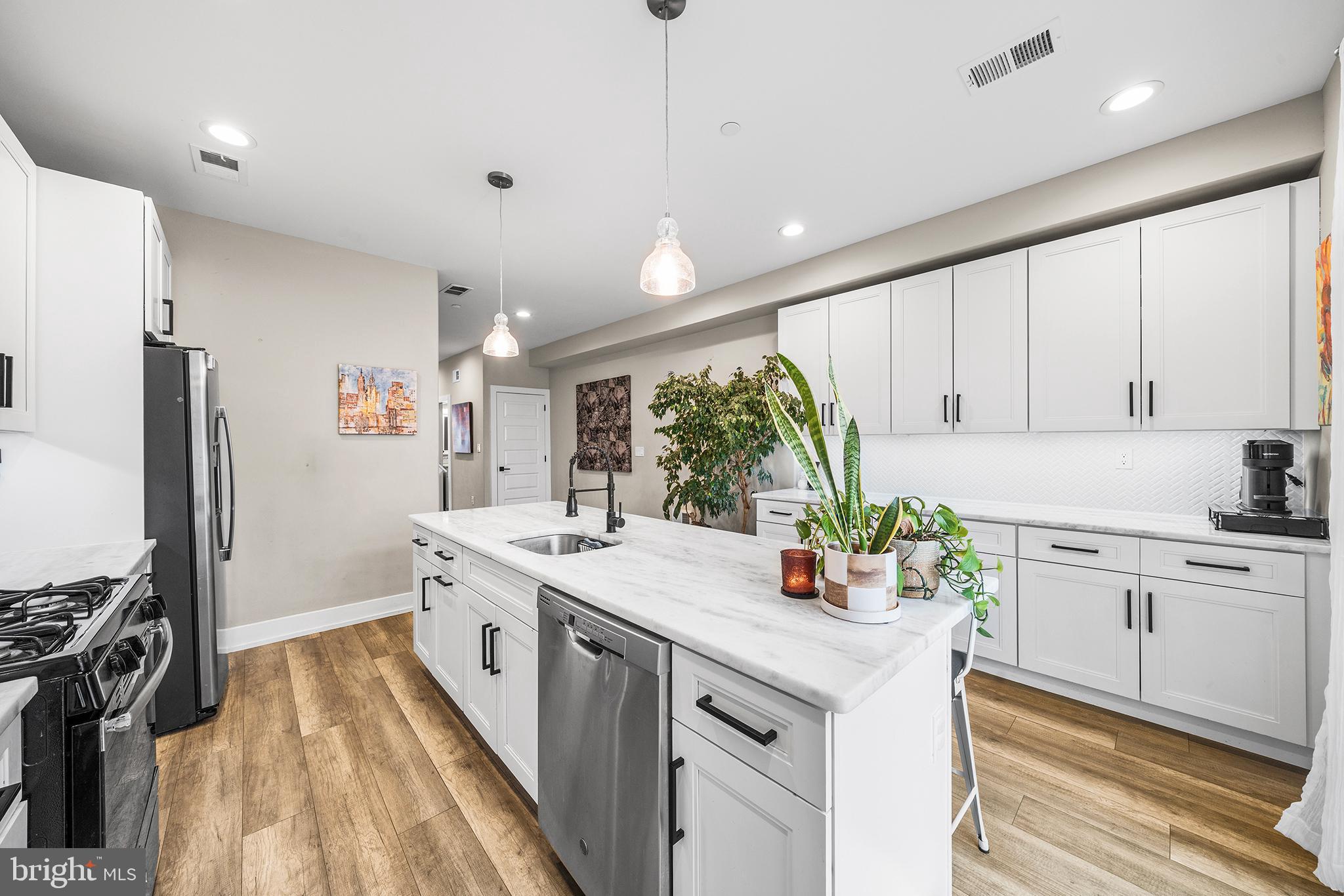 4736 Sheldon Street Philadelphia, PA 19127 - Photo 12 of 37 a kitchen with a sink stove and refrigerator
