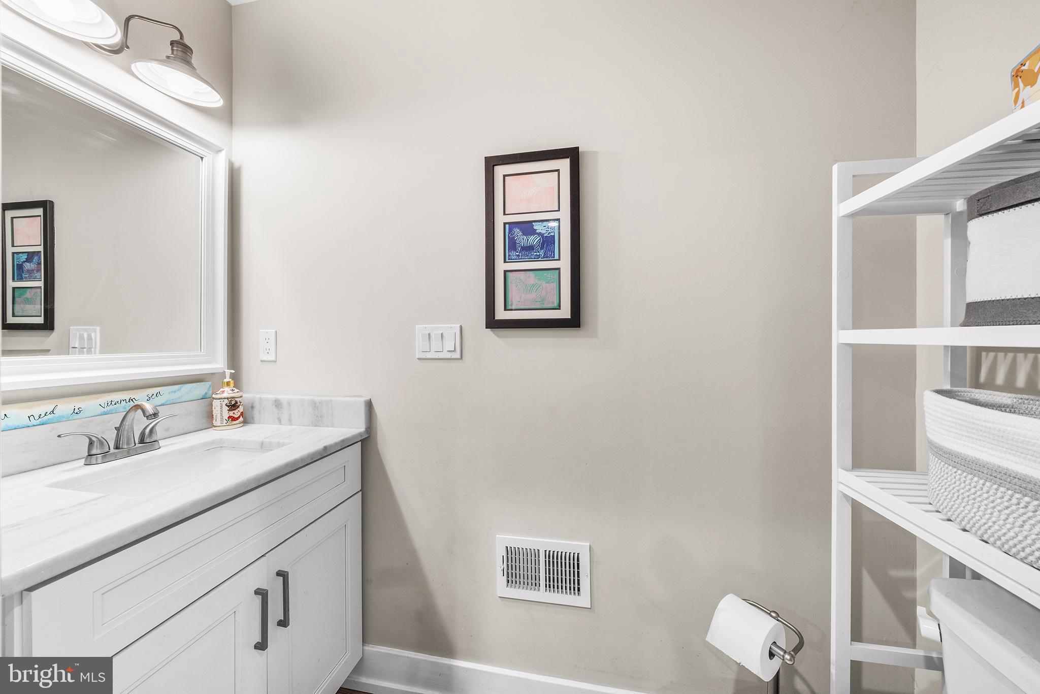 4736 Sheldon Street Philadelphia, PA 19127 - Photo 14 of 37 a bathroom with a sink and a mirror