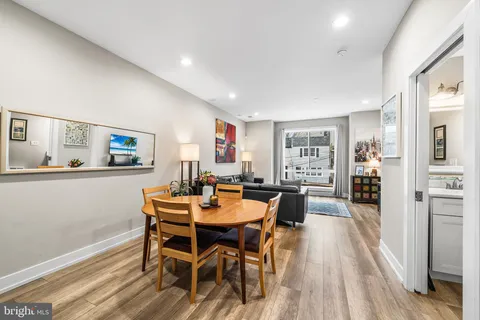 a living room with furniture and a rug