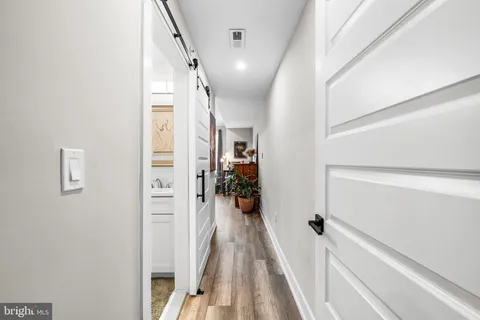 a living room with furniture a window and flat screen tv