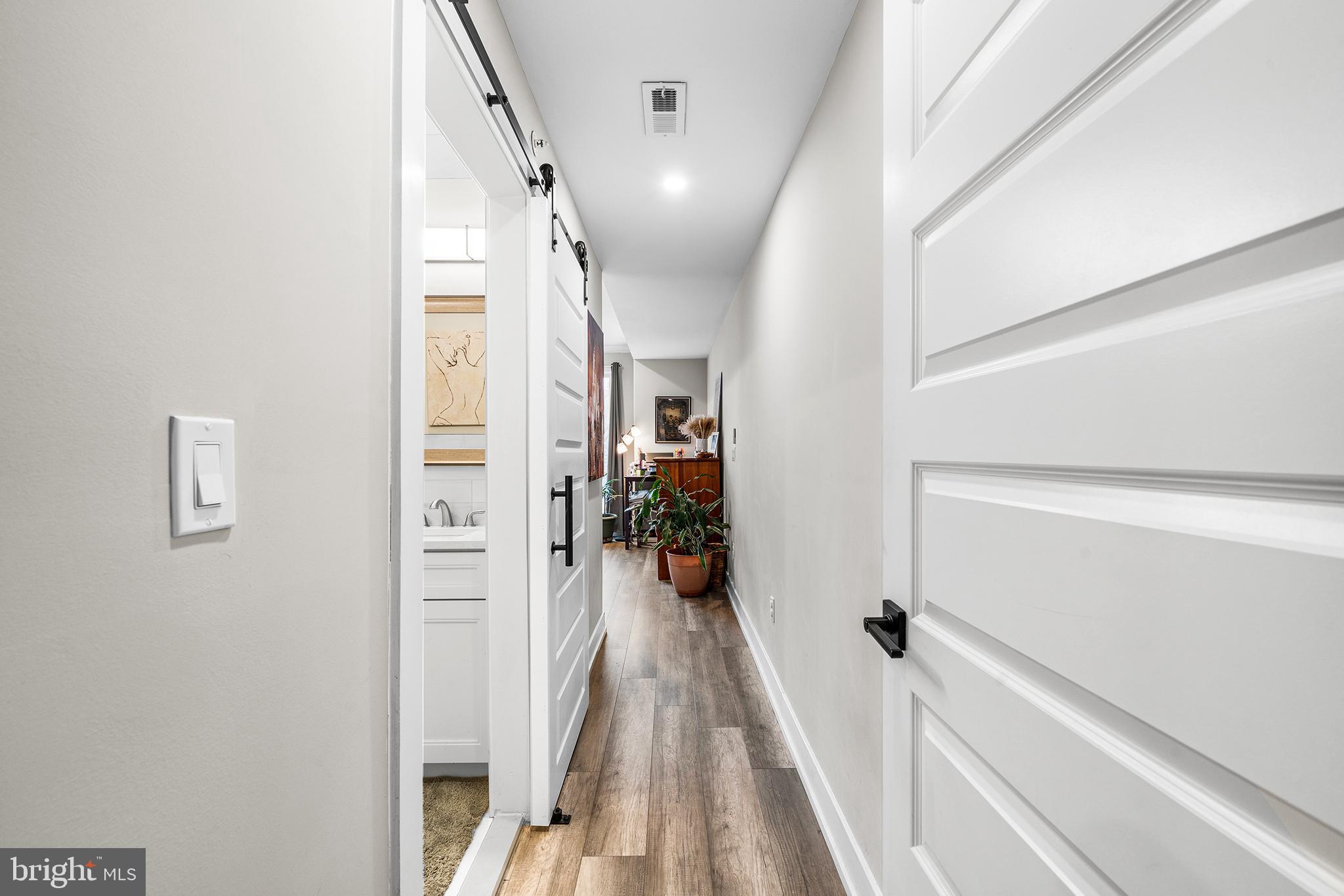 4736 Sheldon Street Philadelphia, PA 19127 - Photo 19 of 37 a view of a hallway with wooden floor and stairs