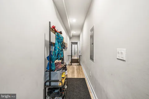 a bedroom with a bed dresser and a window