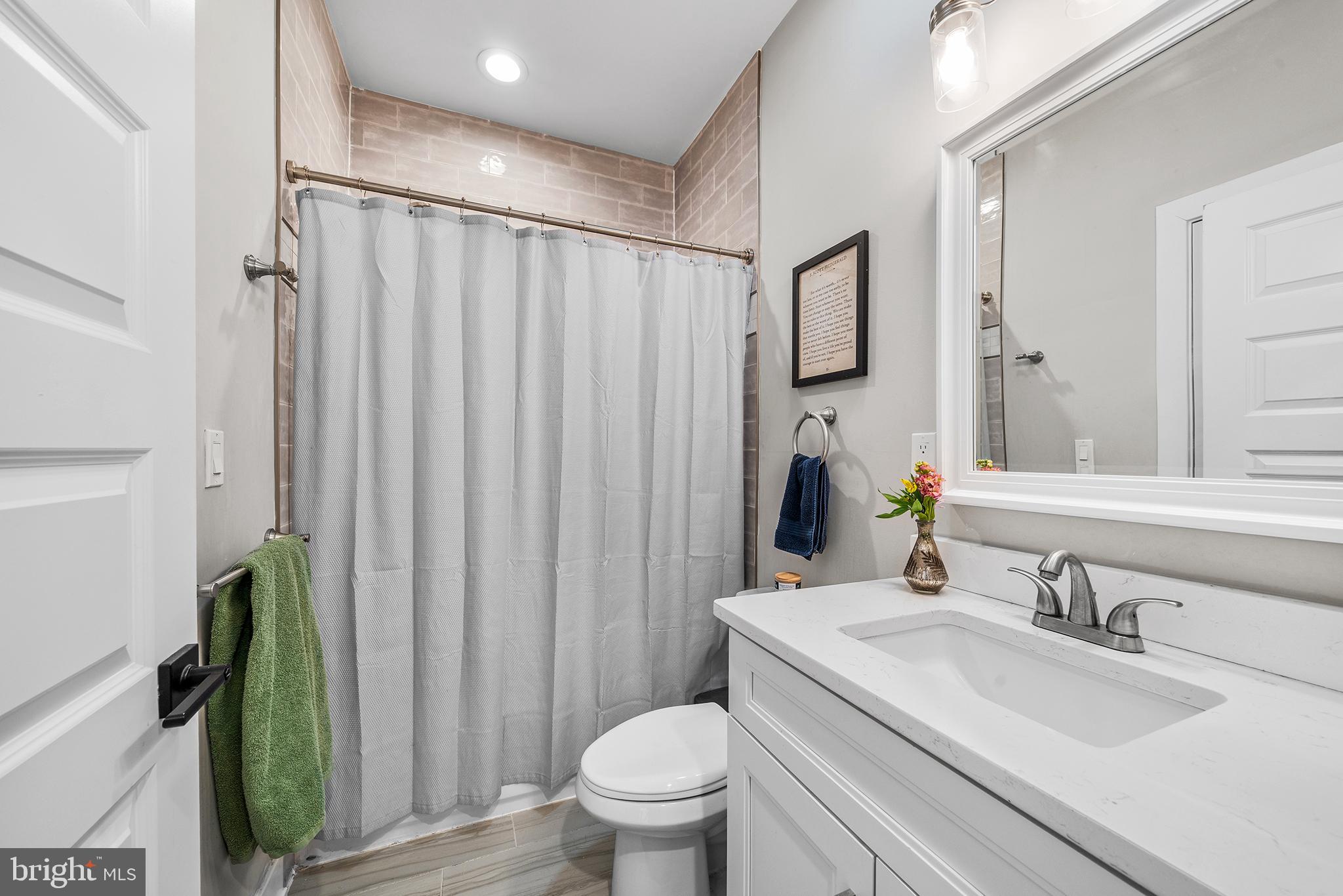 4736 Sheldon Street Philadelphia, PA 19127 - Photo 25 of 37 a bathroom with a granite countertop sink toilet and shower
