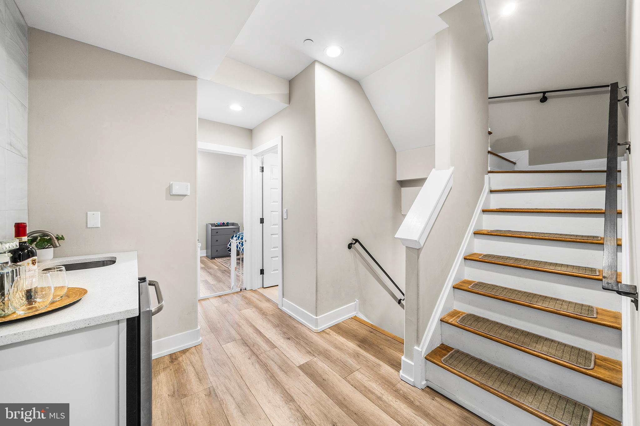 4736 Sheldon Street Philadelphia, PA 19127 - Photo 26 of 37 a view of a bedroom with wooden floor and stairs