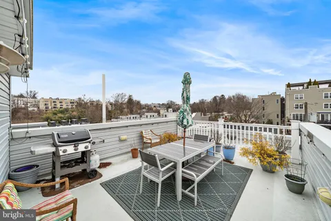 a view of a terrace with furniture