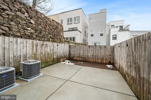 a street corner with a building and trees
