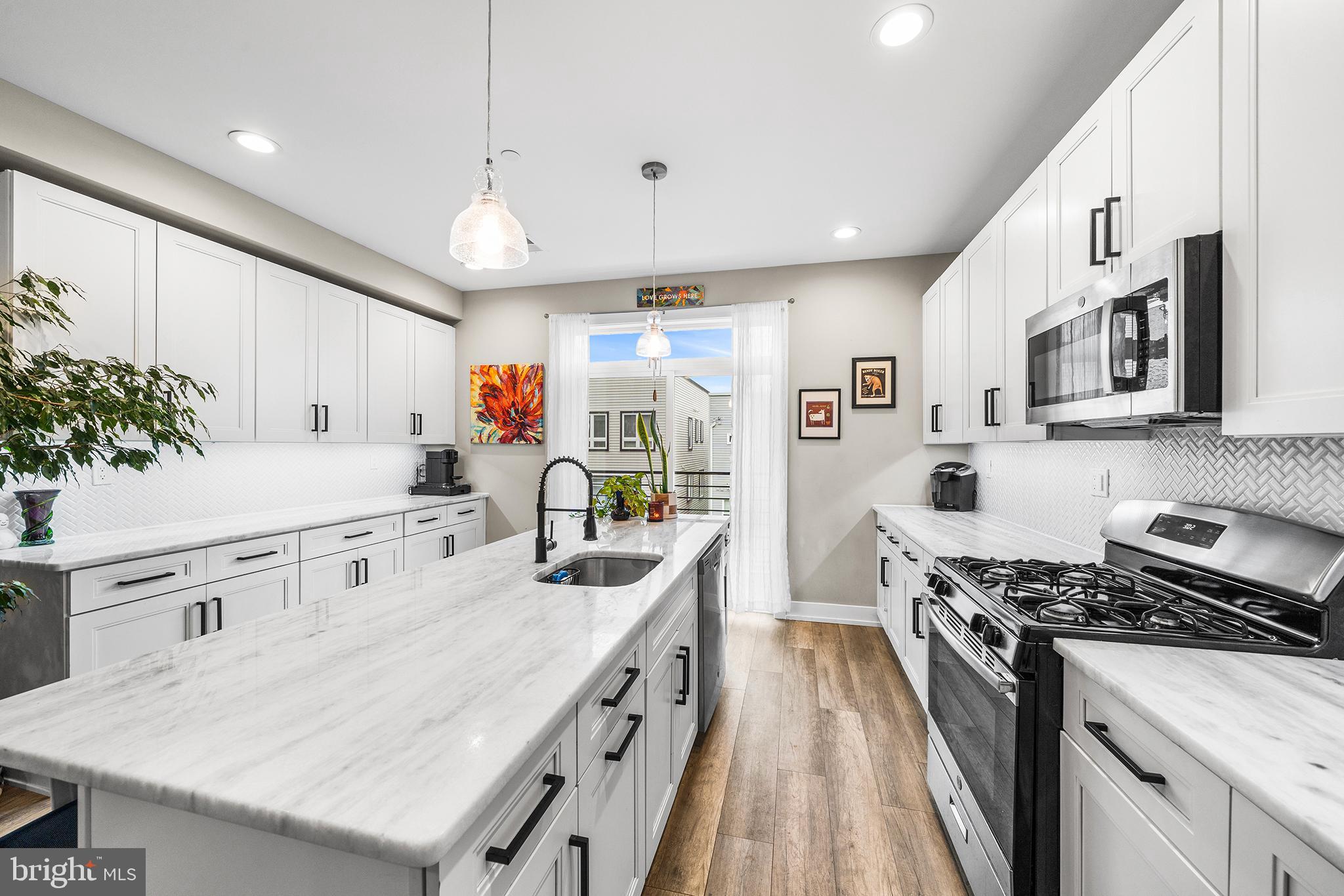 4736 Sheldon Street Philadelphia, PA 19127 - Photo 9 of 37 a kitchen with stainless steel appliances granite countertop a sink stove and refrigerator