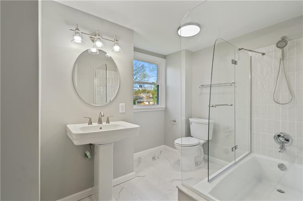 848 Ohio Avenue Monaca, PA 15061 - Photo 13 of 24 a bathroom with a sink toilet and shower
