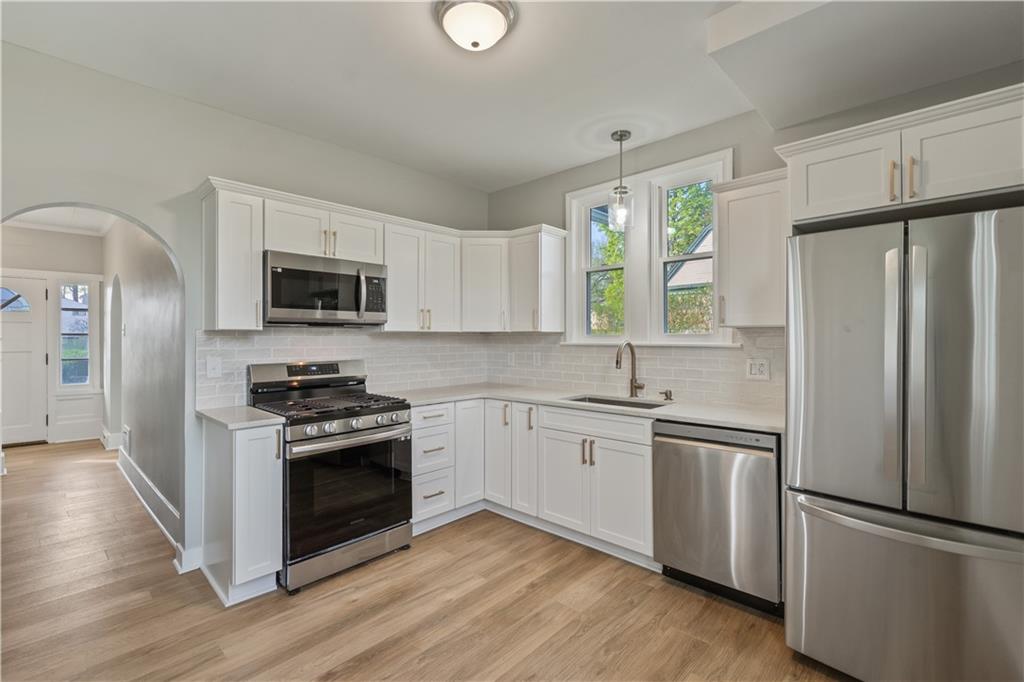 848 Ohio Avenue Monaca, PA 15061 - Photo 3 of 24 a kitchen with stainless steel appliances a refrigerator sink and microwave