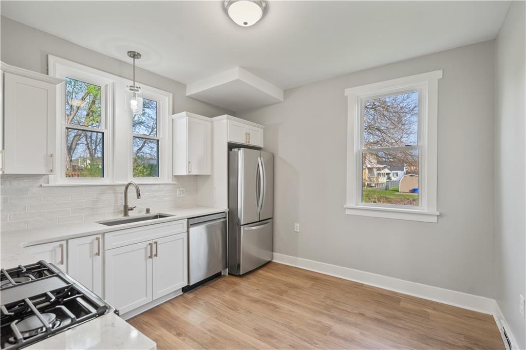 848 Ohio Avenue Monaca, PA 15061 - Photo 5 of 24 a kitchen with stainless steel appliances granite countertop a refrigerator and a sink