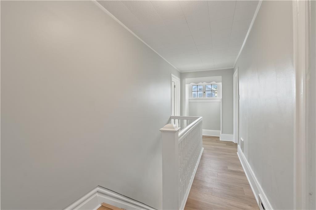 848 Ohio Avenue Monaca, PA 15061 - Photo 10 of 24 a view of a hallway with wooden floor