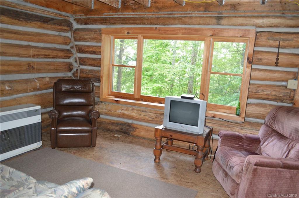 648 Sutton Road Waynesville, NC 28785 - Photo 3 of 24 a living room with furniture and a window