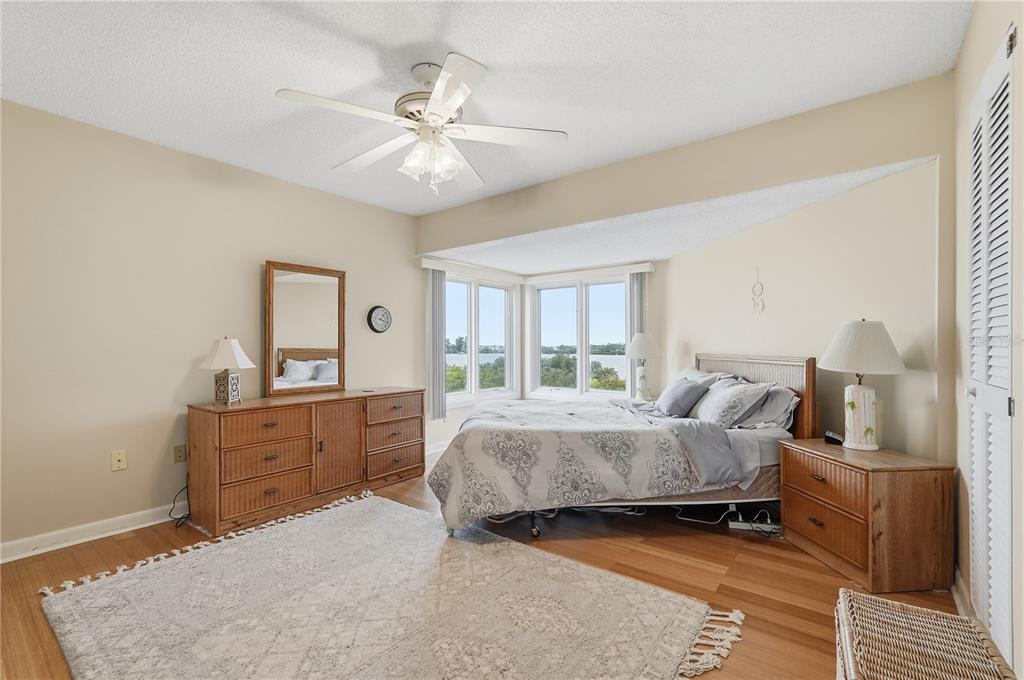 1500 Sunset Road, Unit C10 Tarpon Springs, FL 34689 - Photo 15 of 27 a bed room with a bed and a dresser