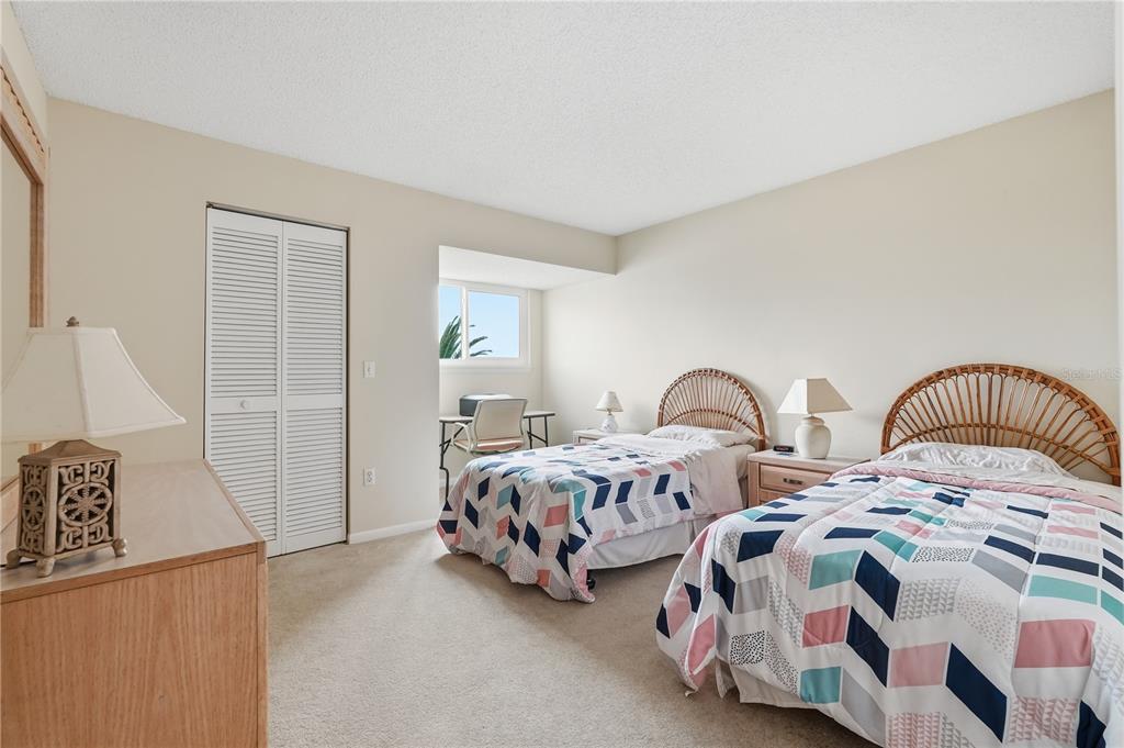 1500 Sunset Road, Unit C10 Tarpon Springs, FL 34689 - Photo 18 of 27 a bedroom with two beds and a dresser
