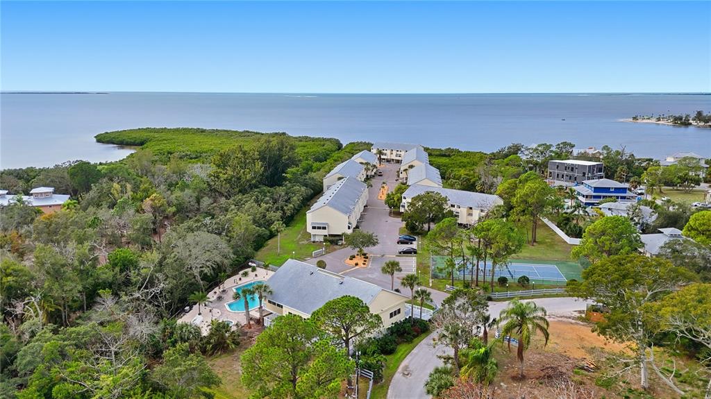 1500 Sunset Road, Unit C10 Tarpon Springs, FL 34689 - Photo 24 of 27 an aerial view of a houses with a yard
