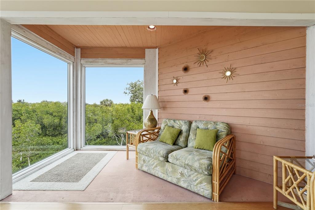 1500 Sunset Road, Unit C10 Tarpon Springs, FL 34689 - Photo 5 of 27 a view of patio with a couch and wooden floor