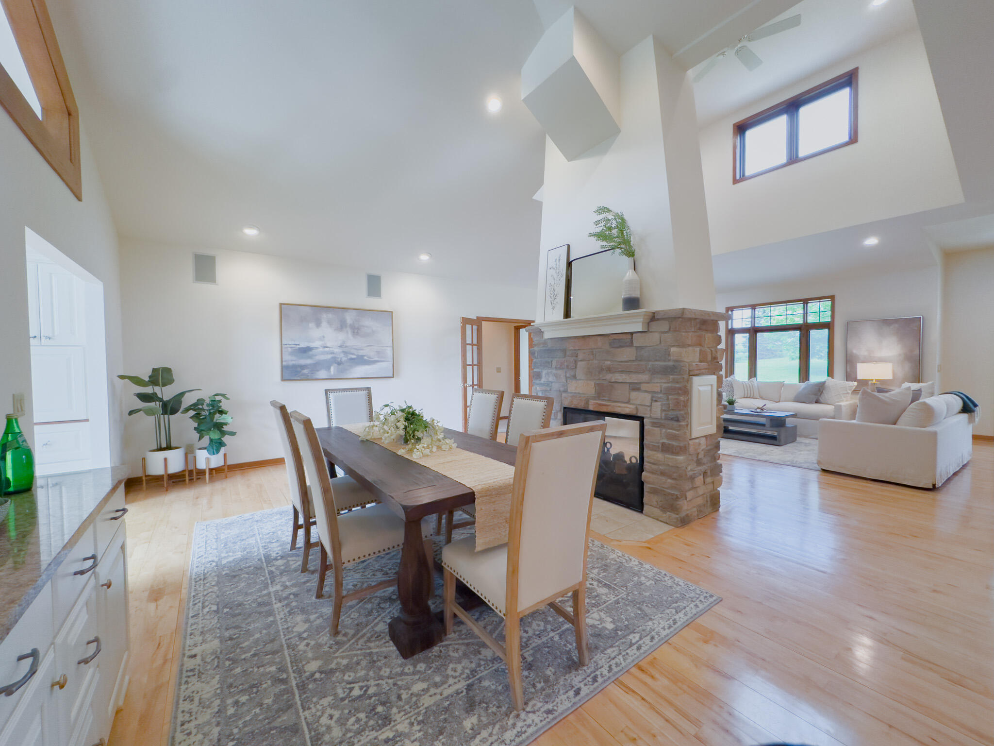 11604 North Granville Road Mequon, WI 53097 - Photo 13 of 49 Vaulted ceilings, hardwood floors, built in buffet and 2 sided fireplace