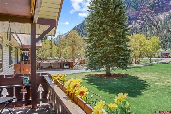 a view of a backyard with sitting area