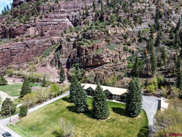 an aerial view of residential houses with outdoor space