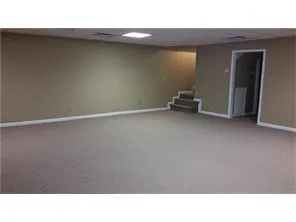 a bathroom with a sink vanity mirror and toilet