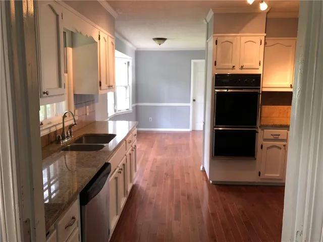 a bathroom with a sink a toilet and a bathtub