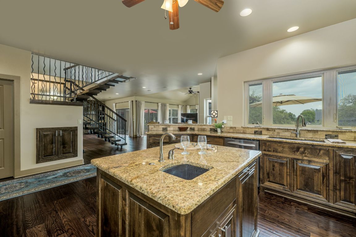 600 Mountain Dew Road Horseshoe Bay, TX 78657 - Photo 16 of 38 a kitchen with a sink a stove and cabinets
