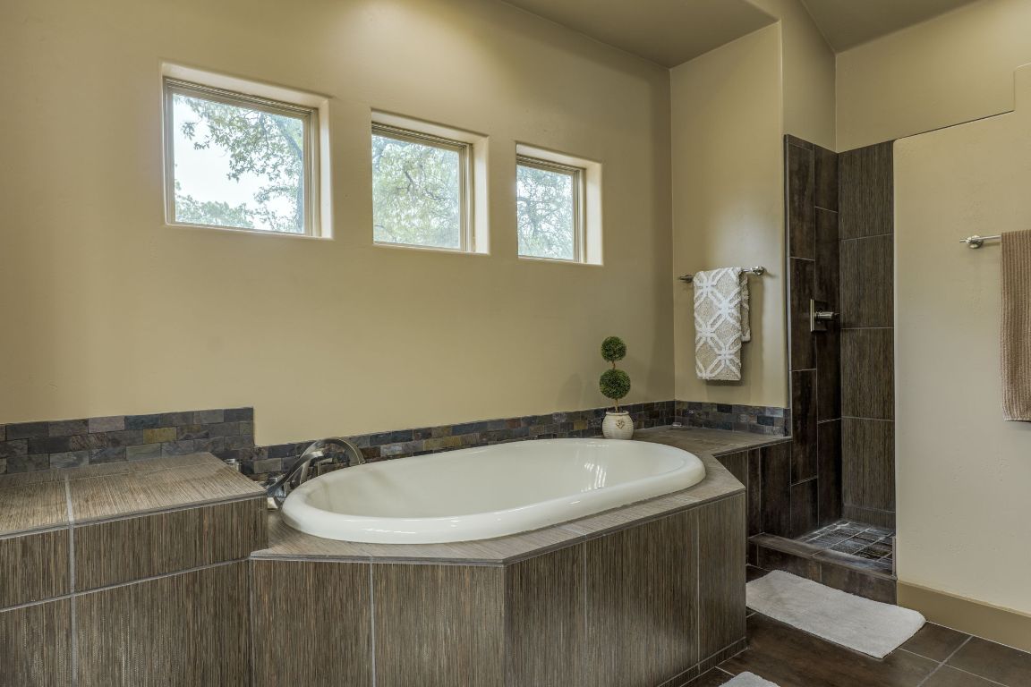 600 Mountain Dew Road Horseshoe Bay, TX 78657 - Photo 22 of 38 a bathroom with a sink and a mirror