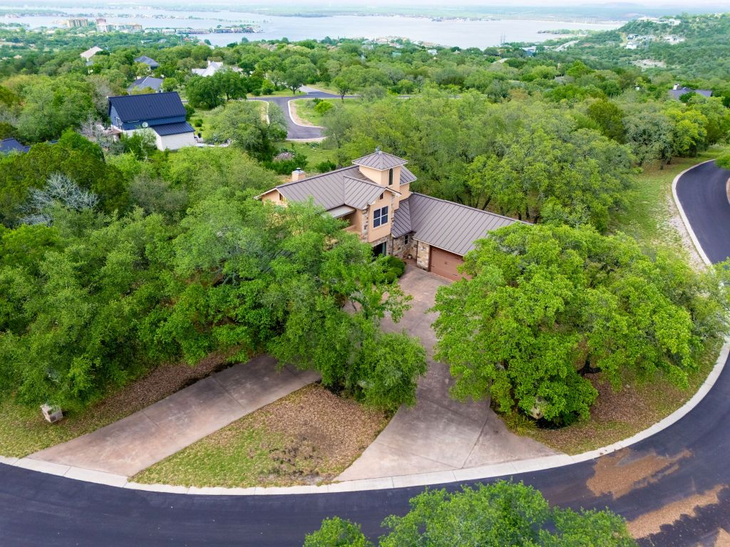 600 Mountain Dew Road Horseshoe Bay, TX 78657 - Photo 3 of 38 an aerial view of a house with yard