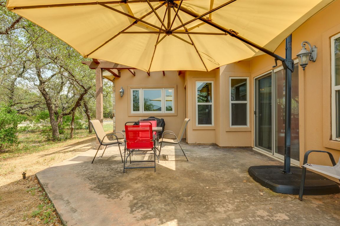 600 Mountain Dew Road Horseshoe Bay, TX 78657 - Photo 33 of 38 a backyard of a house with seating space